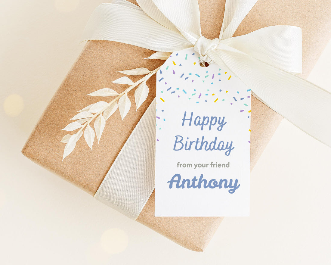 A brown gift box with a white ribbon and a tag that reads "Happy Birthday from your friend Anthony".