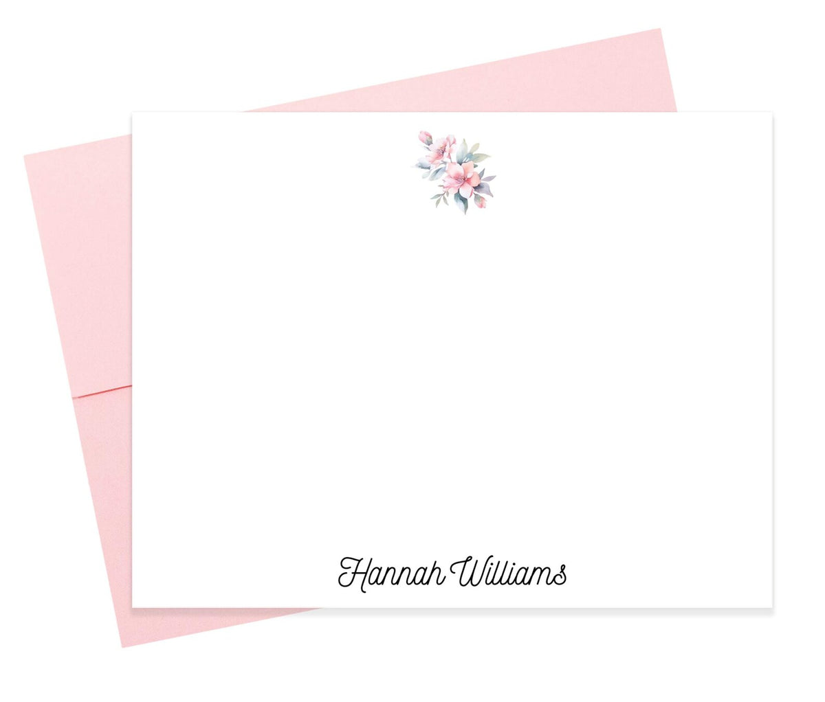 A blank white card with a pink envelope underneath, featuring a floral design on the top right corner.