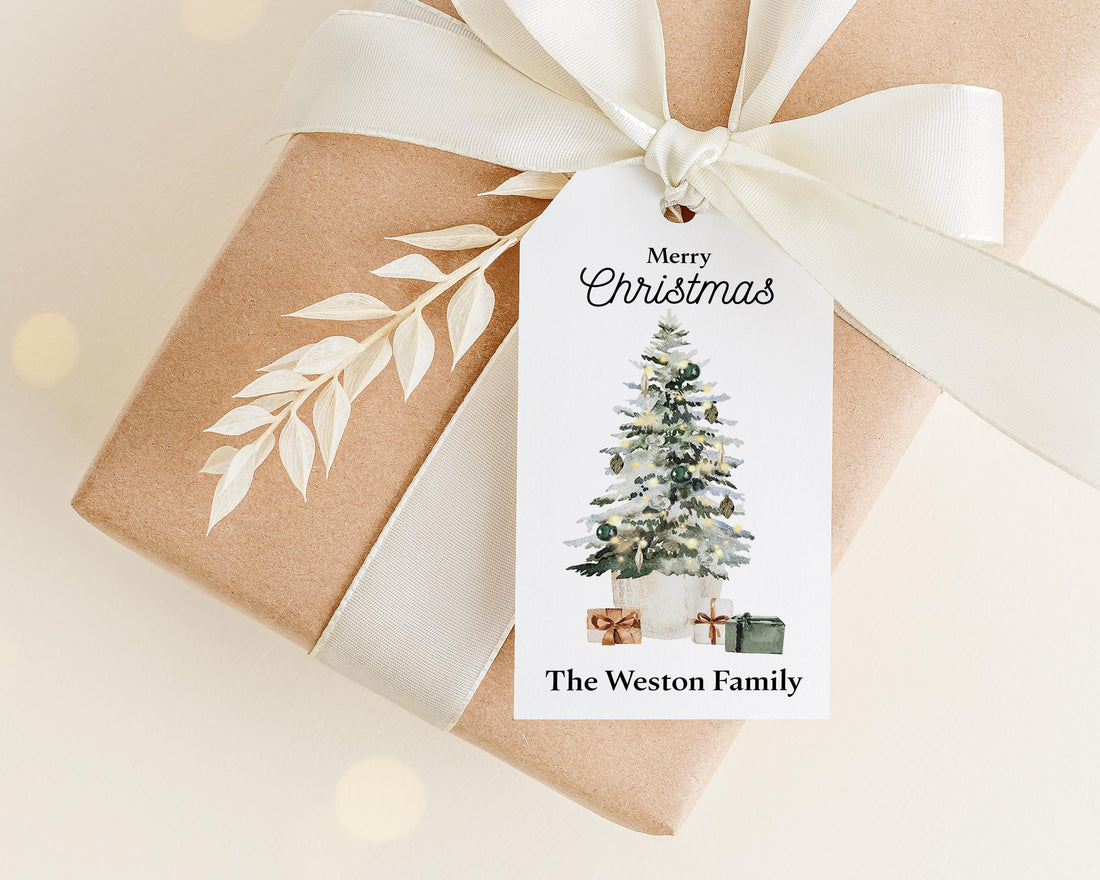 A brown gift box with a white ribbon and a white tag that reads "Merry Christmas The Weston Family".