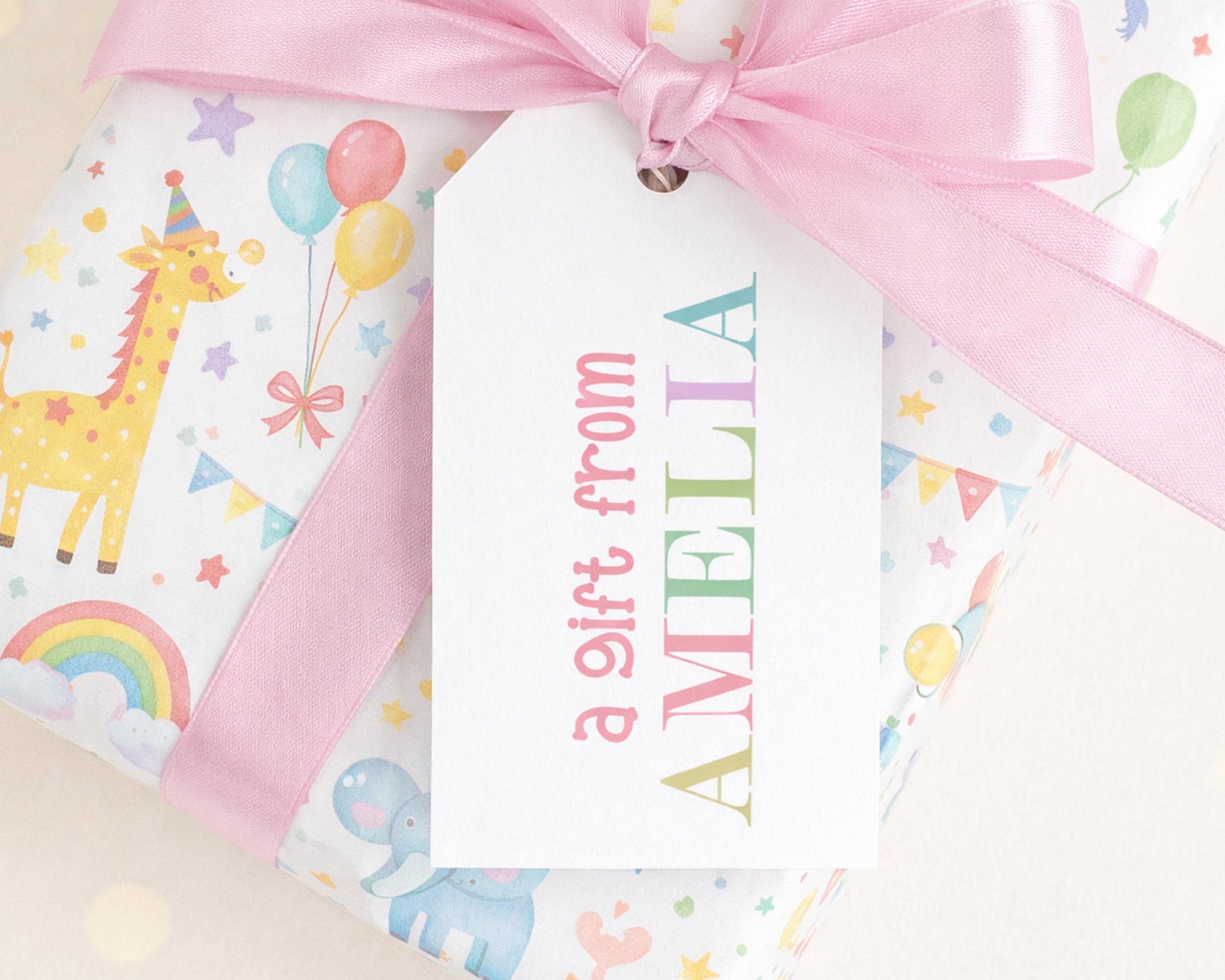 A gift wrapped in a colorful paper with a pink ribbon and a tag that says "Amelia".