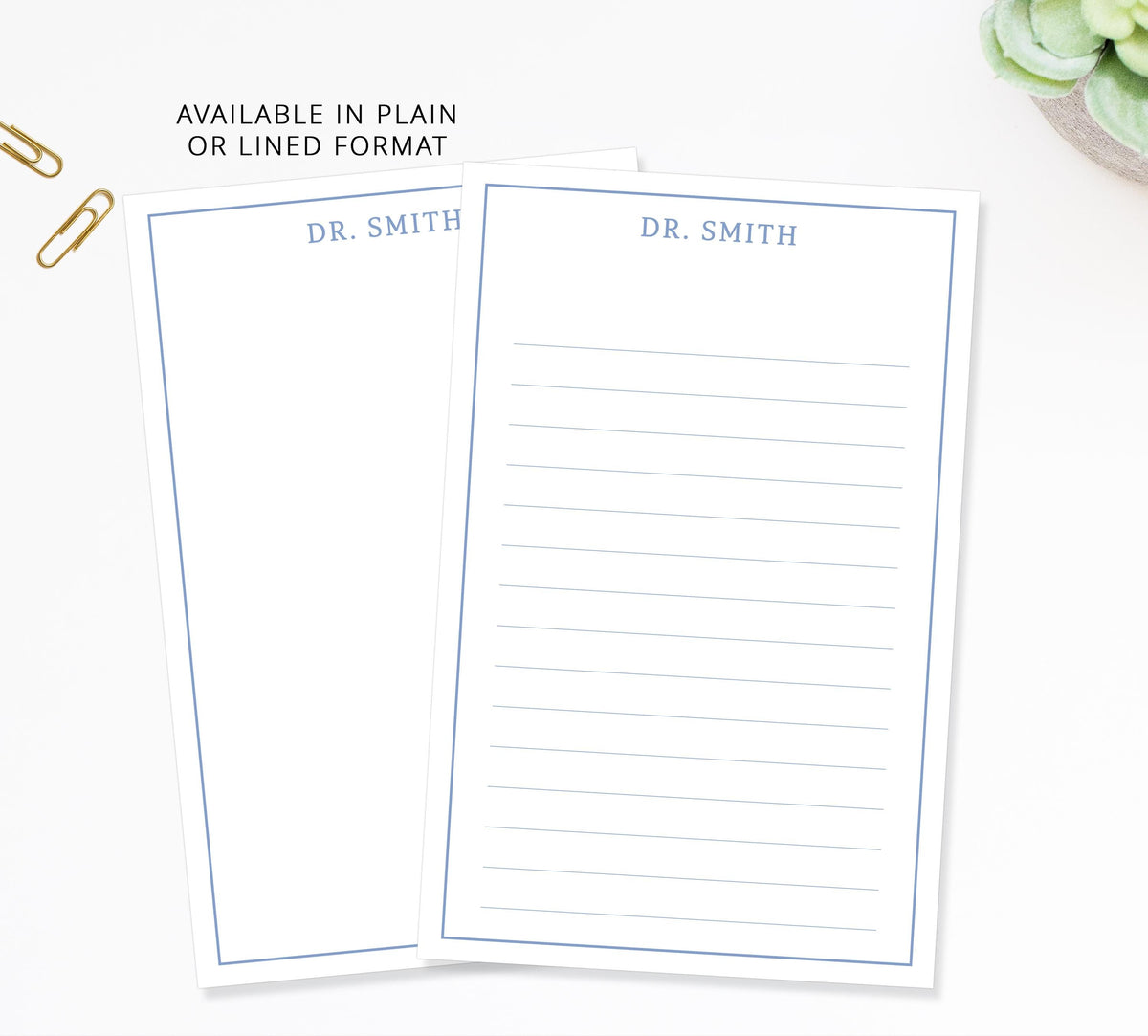 two blank lined paper pads with the name 'DR. SMITH' printed on them, along with a few office supplies such as a stapler and a pair of scissors.