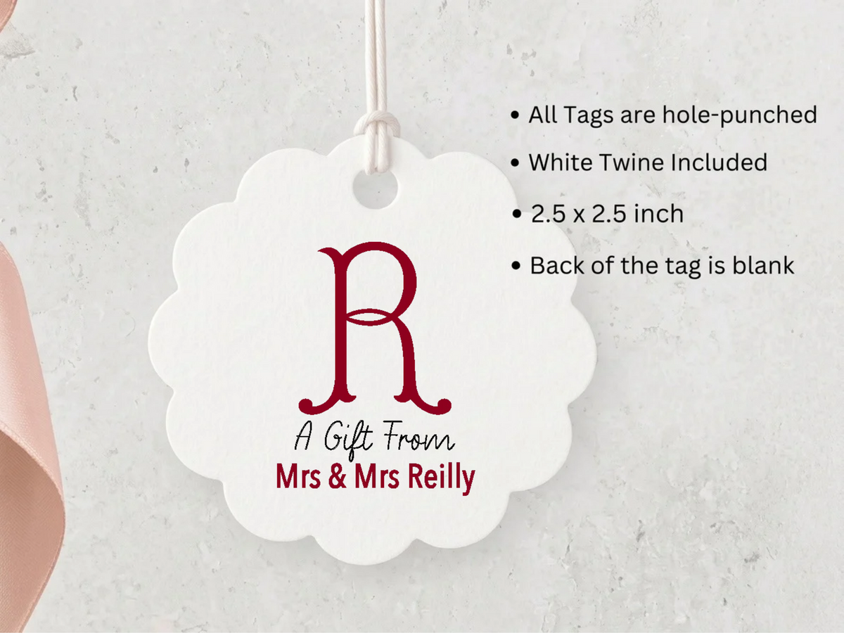A white scalloped tag with a red letter "R" and text that reads "A Gift From Mrs & MrsReilly" hangs against a white background.