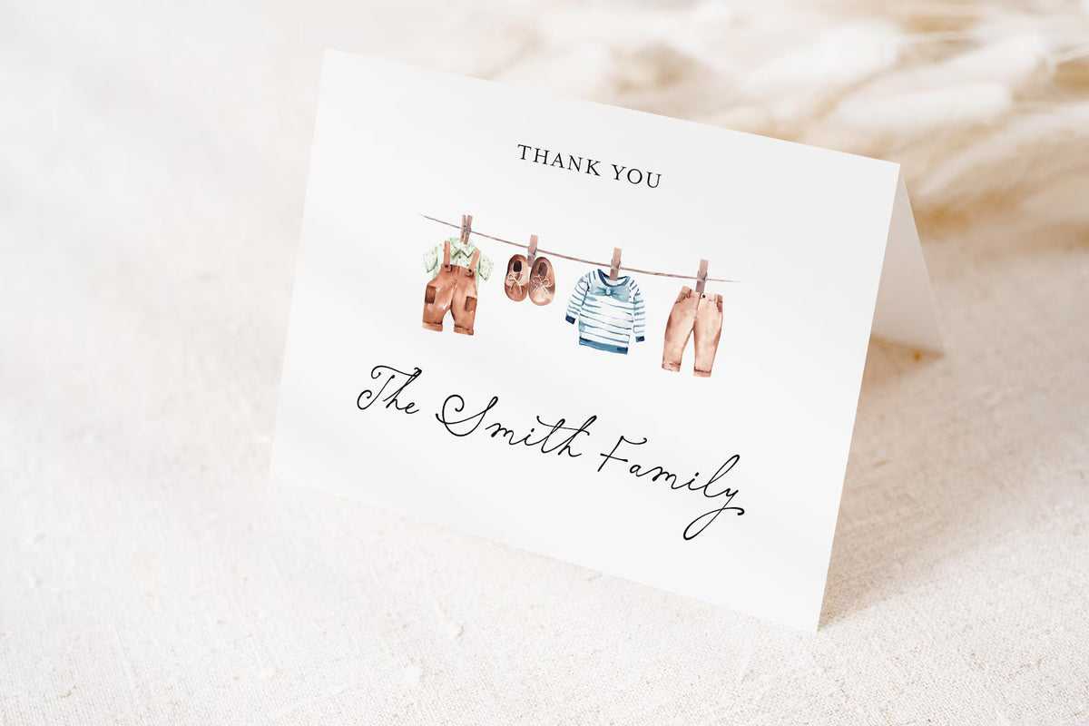 A white card with a gratitude message and illustrations of clothes hanging on a clothesline.